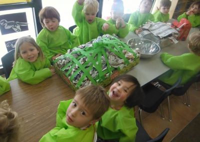 A Group of Children in Green Overalls